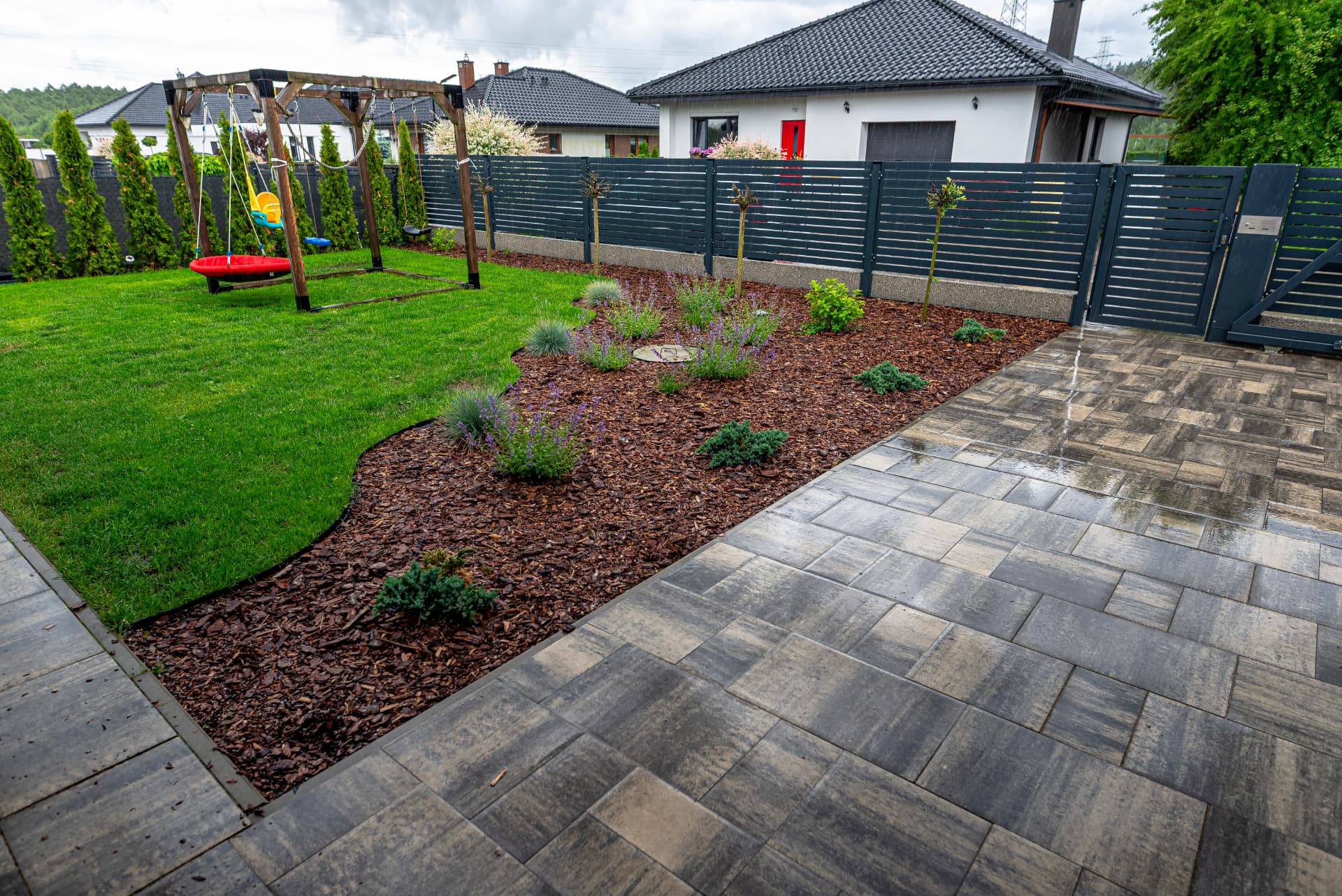New paved patio beside a landscaped garden in Colchester, Essex